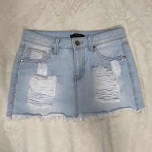 Distressed denim miniskirt